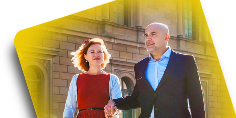 photo of man and woman smiling inside buccal film background